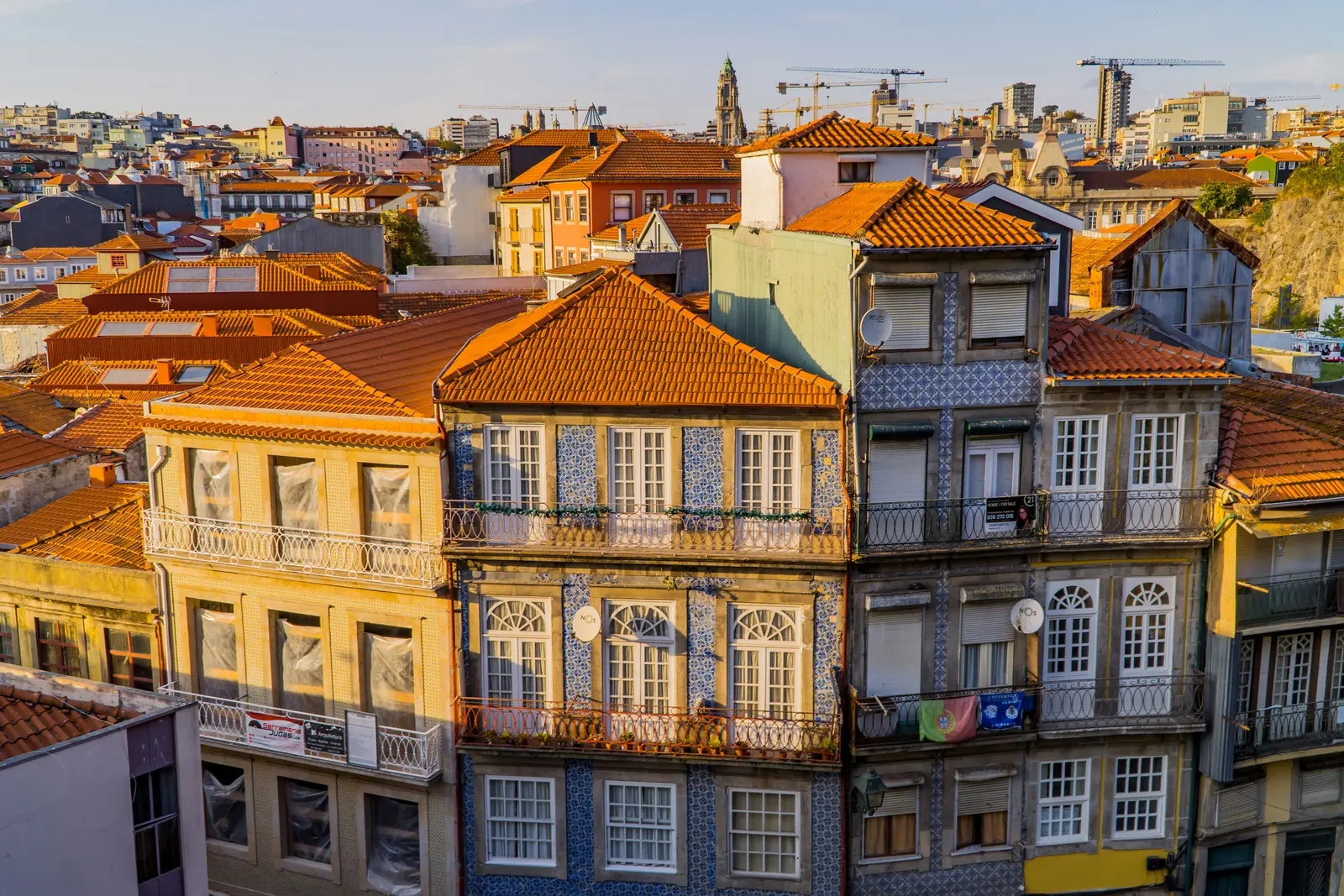 Azulejo-tiled rooftops and residential facades in a Porto neighbourhood.